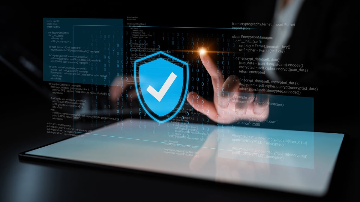 Concept of digital security with a shield symbol representing data protection on a touchscreen device in a dark setting, highlighting cybersecurity importance and user safety efforts.